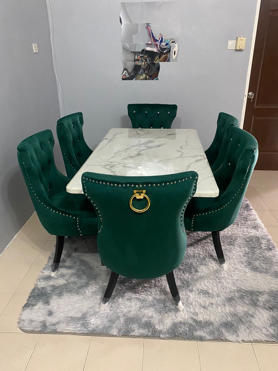 Green velvet Butterfly dining set with marble table in compact dining area