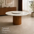 Siena round marble dining table with fluted wood base in a warm contemporary interior