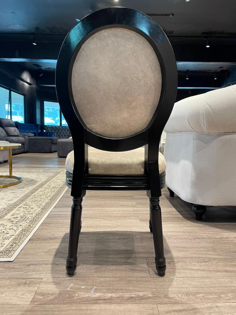 Roma dining chair shown in dining set styling