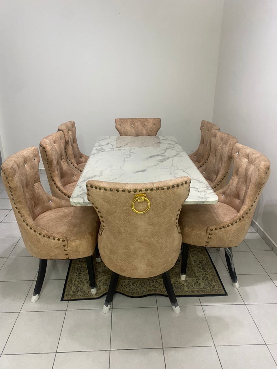 Butterfly marble dining set side angle with upholstered chairs