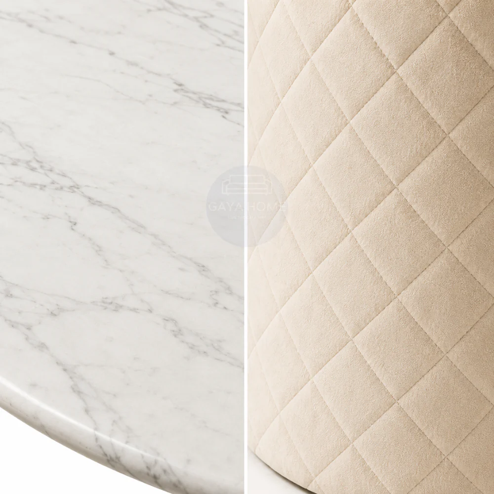 Close-up of the Chester marble tabletop and diamond-quilted upholstered base