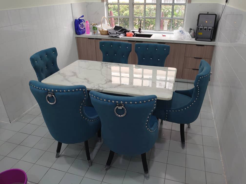 Butterfly marble dining set with velvet chairs in dining space