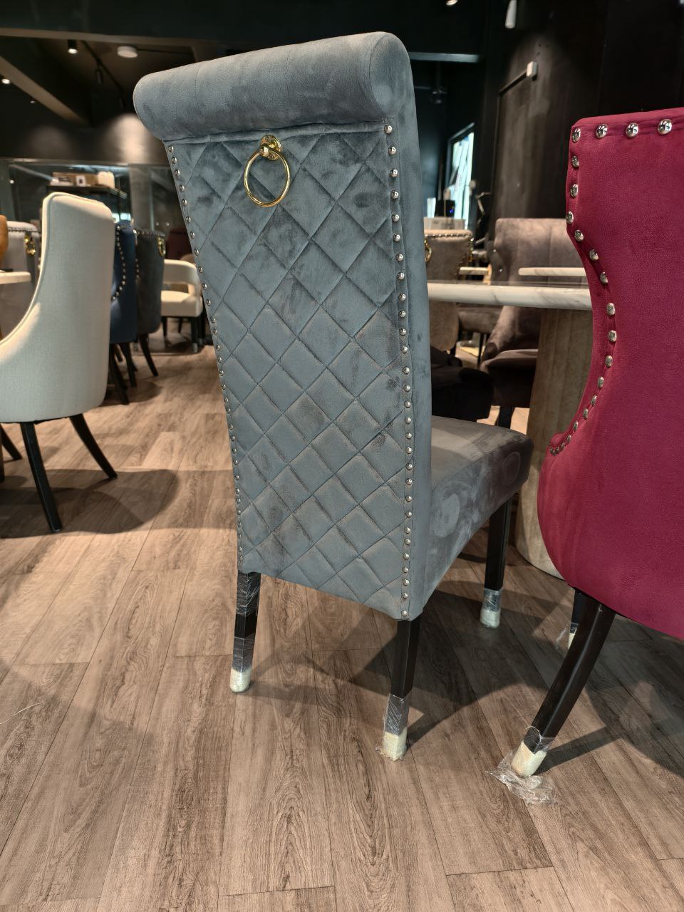 Diamond-quilted dining chair back view with ring pull detail