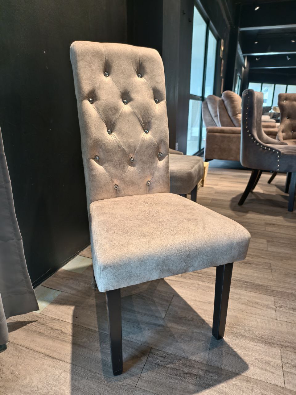 Diamond-tufted dining chair front view in grey upholstery