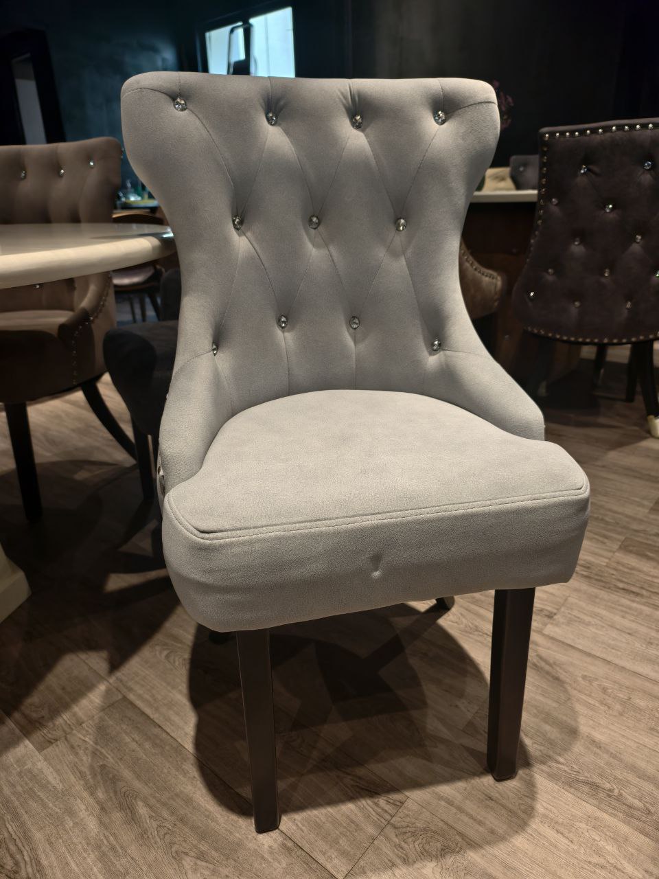Tufted grey Butterfly dining chair front view with velvet upholstery