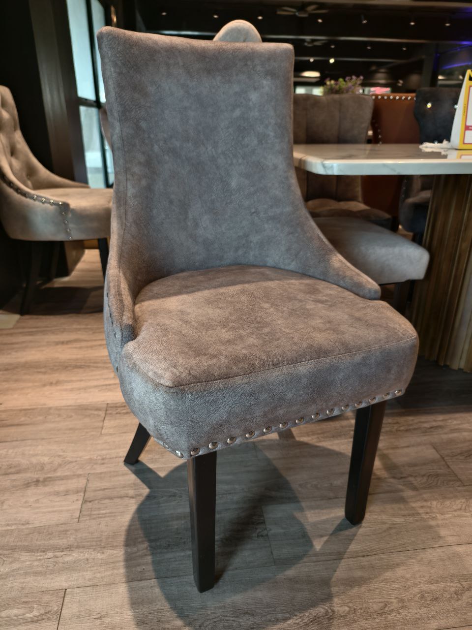 Classic premium dining chair front view in grey upholstery